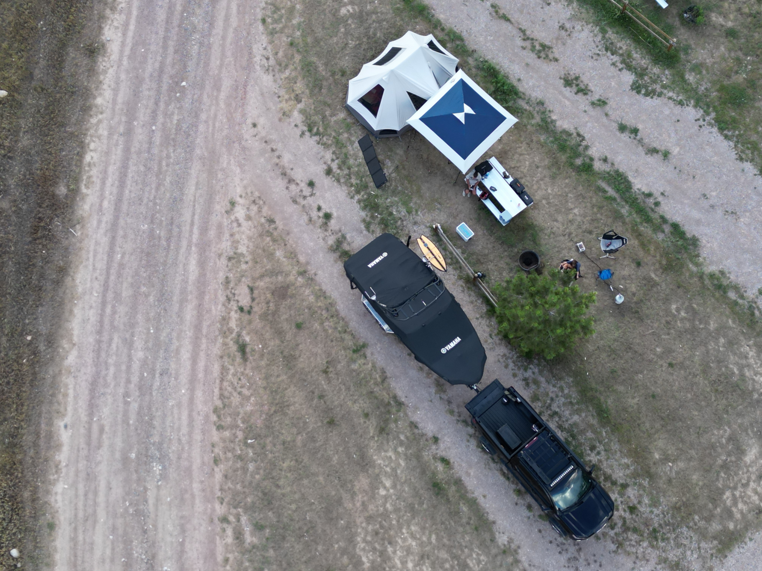 Yamaha boat with a truck and camping tent